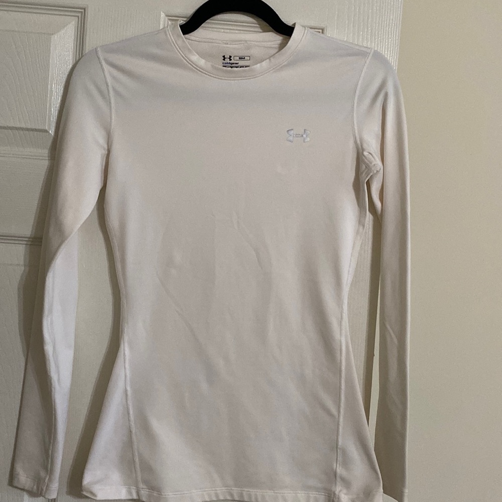 Under Armour cold gear fitted long sleeved white crew top. Size S.
